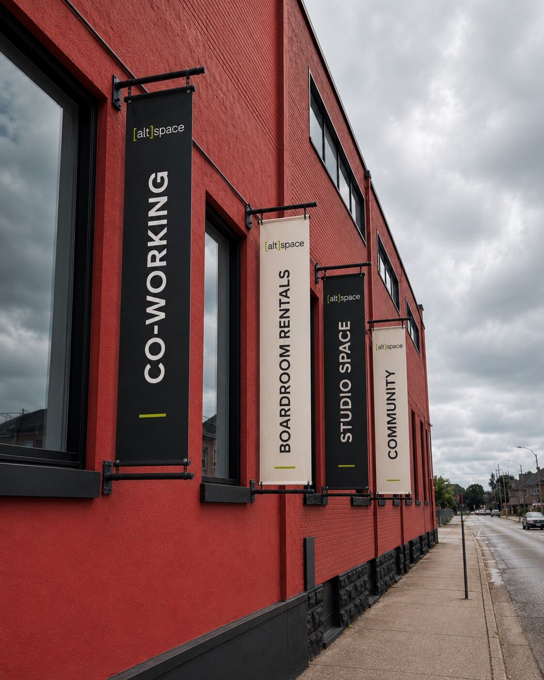 Concept rendering of the red brick Altspace building on Christina Street with black and cream banners reading coworking, boardroom rentals, studio space and community